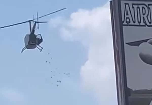 Необычная завещание: вертолет сбросил деньги на прохожих в Детройте по воле умершего владельца автомойки